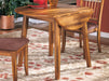 Ashley Express - Berringer Round DRM Drop Leaf Table - Walo Furniture