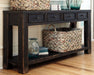 Ashley Express - Gavelston Sofa Table - Walo Furniture