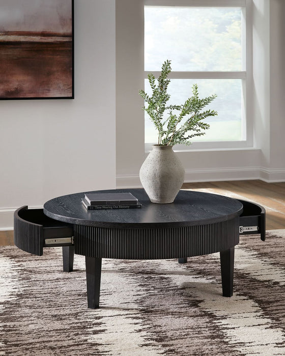 Ashley Express - Marstream Round Cocktail Table - Walo Furniture