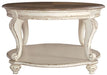 Ashley Express - Realyn Oval Cocktail Table - Walo Furniture