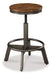 Ashley Express - Torjin Counter Height Dining Table and 4 Barstools - Walo Furniture